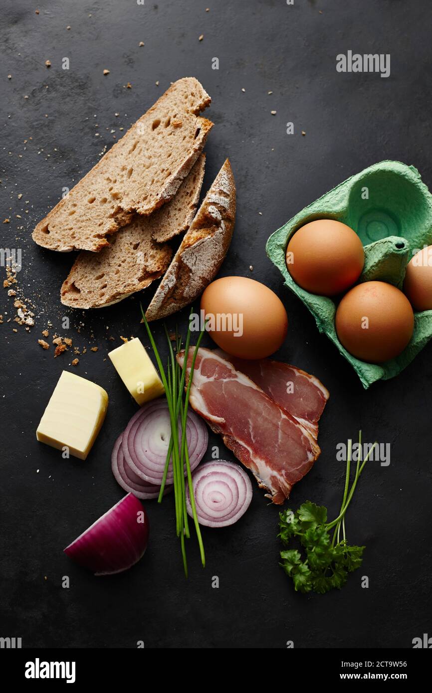 Butter, eggs, bread, bacon and onions Stock Photo