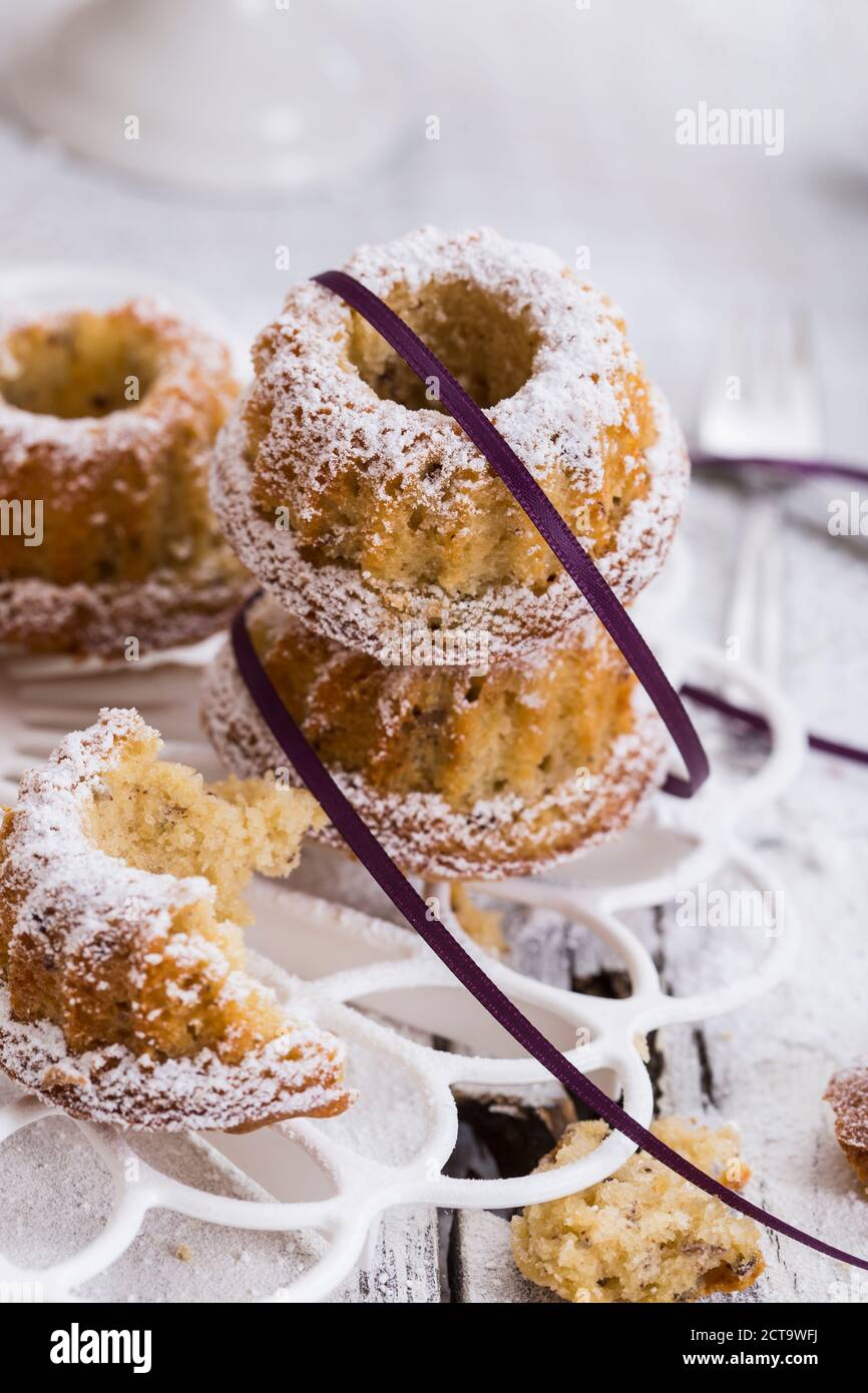 Little ring cakes made from nuts strewed with powdered sugar, studio shot Stock Photo
