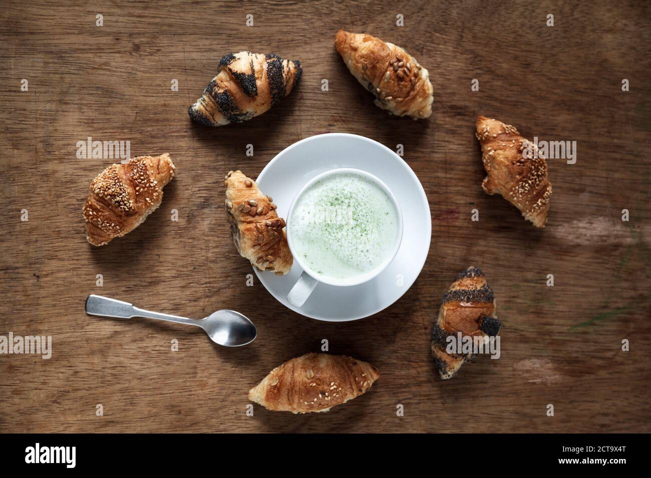Mini croissants and cup of Matcha Latte Stock Photo