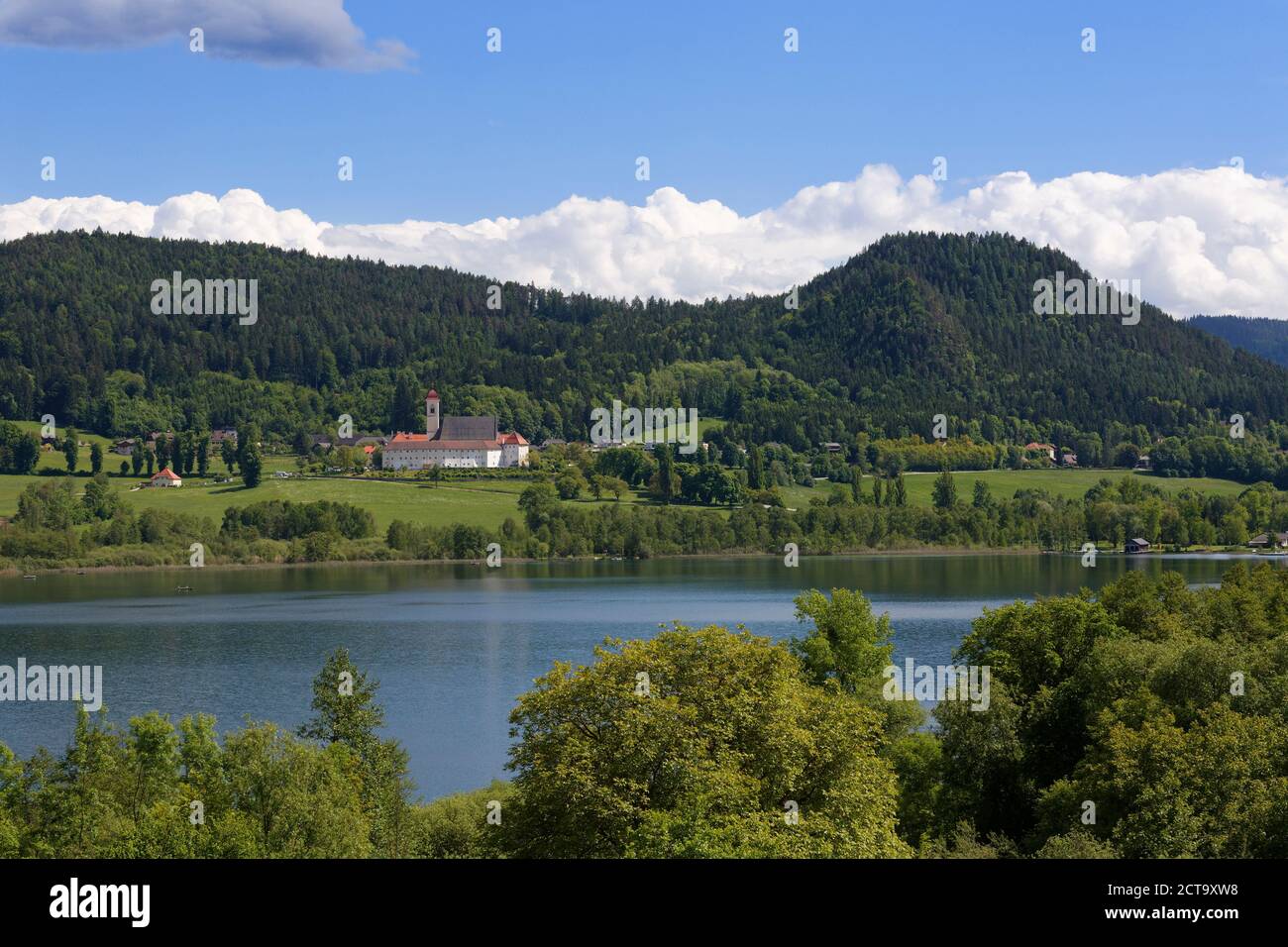 Austria, Carinthia, View of St Georgen abbey and Sankt Georgen am Langsee at Langsee Lake Stock Photo
