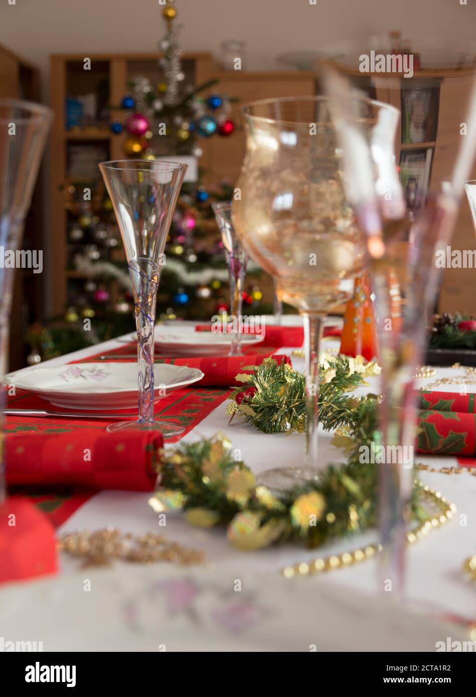Rose wine glasses and bottles on table served for festive dinner party  Stock Photo by Olga_Kochina