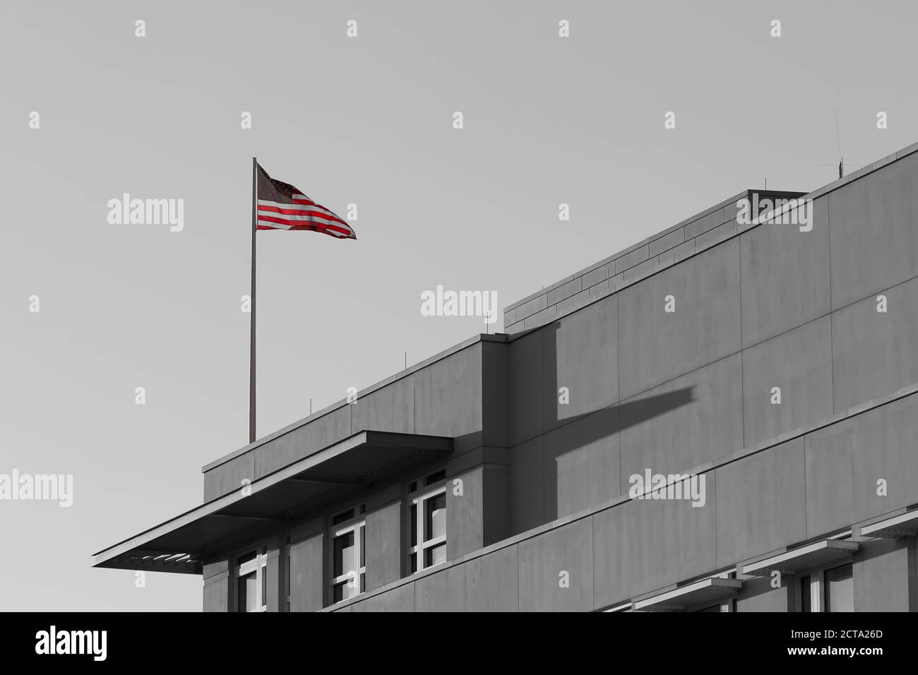 Germany, Berlin, part of facade of US embassy with American flag Stock Photo
