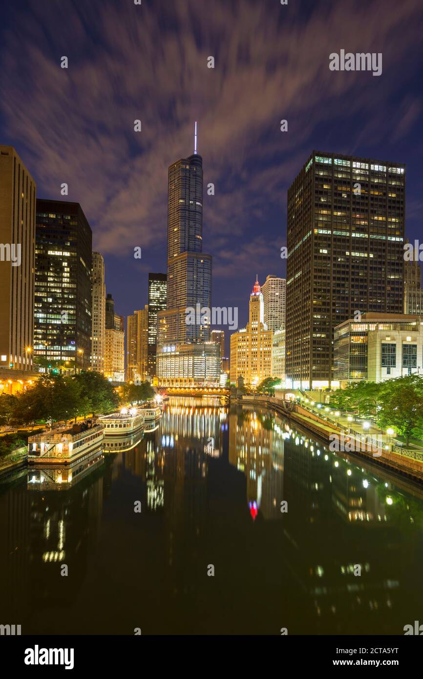USA, Illinois, Chicago, High-rise buildings, Trump Tower at Chicago River at night Stock Photo