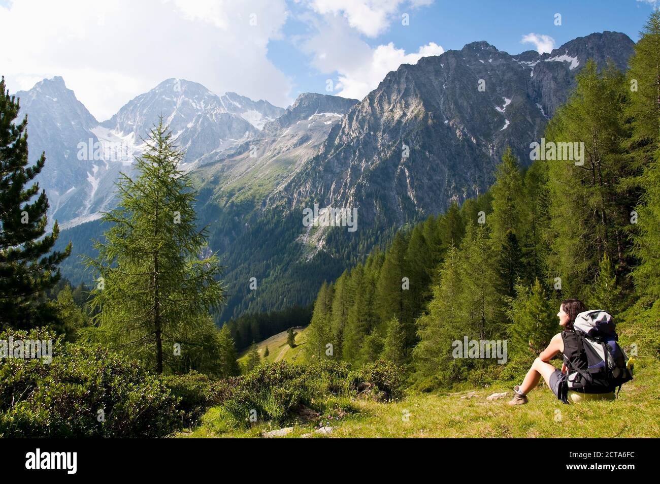 Italy, South Tyrol, Puster Valley, Antholz-Obertal, Staller Saddle, Hiker looking at Antholz Valley Stock Photo
