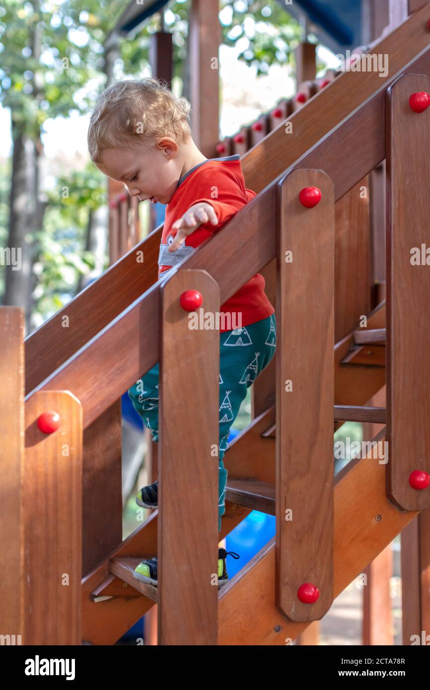 Little Boy Playing at Playground Stock Photo - Alamy