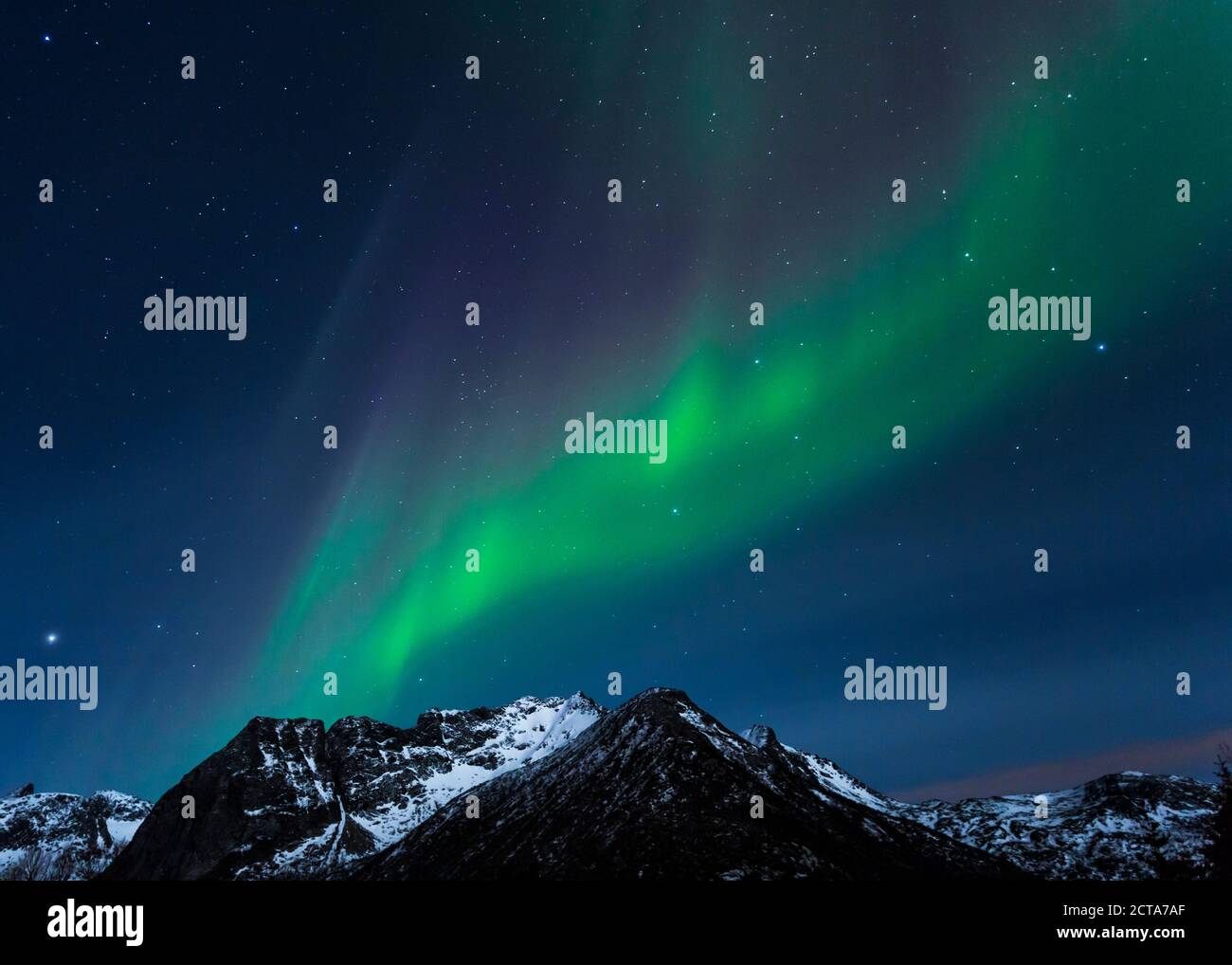 Norway, Lofoten, Polar lights (aurora borealis) on Gimsoy Stock Photo