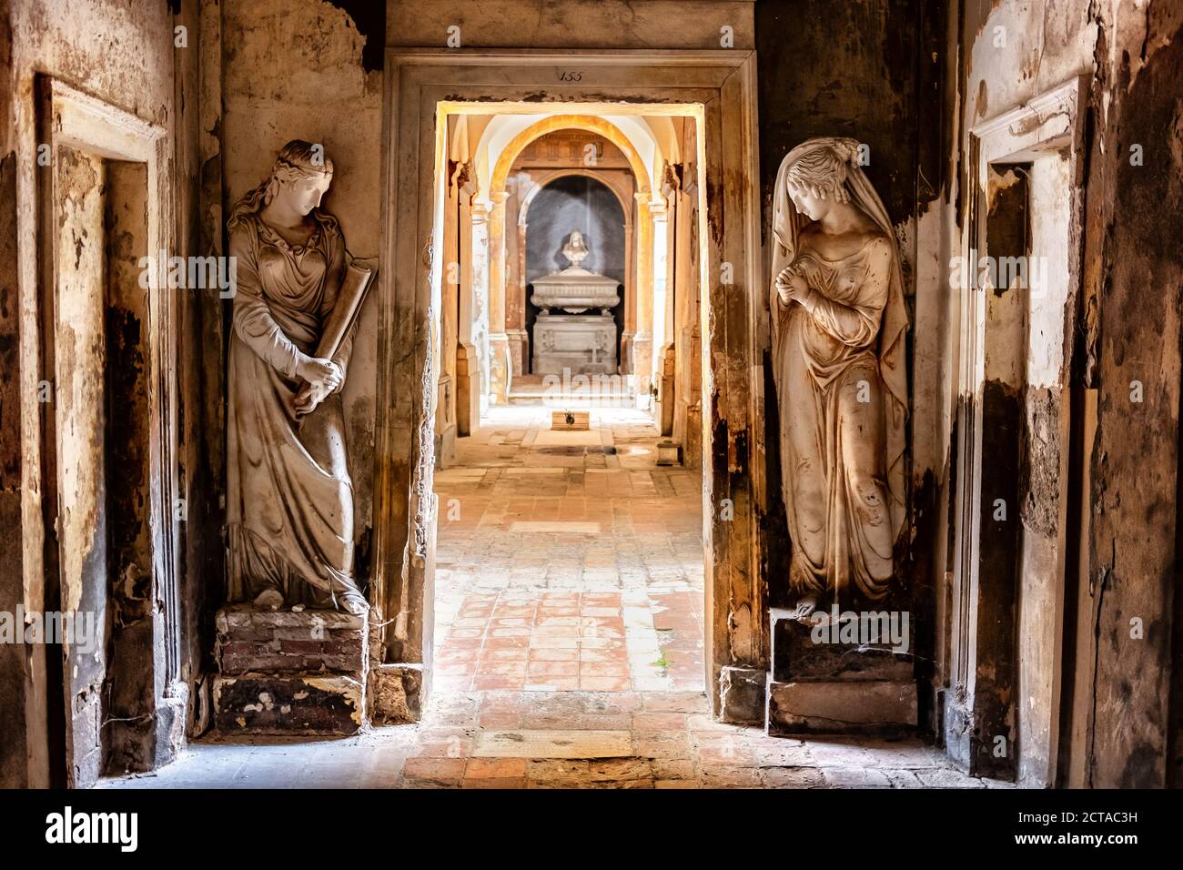 cemetery corridor background with two statues Stock Photo