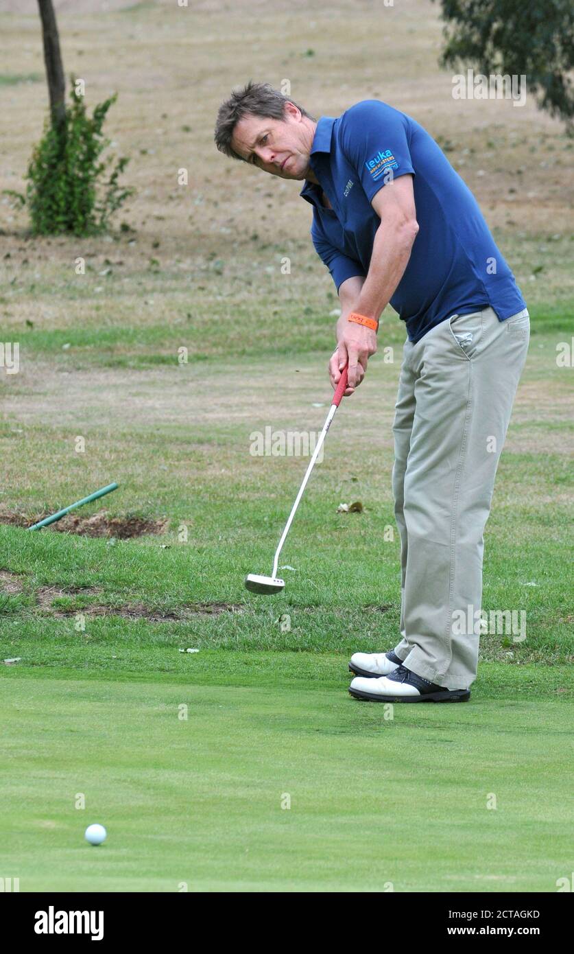 CHISWICK,LONDON,UK: JULY 16th 2010.  Actor Hugh Grant (R) participates in the Leuka Charity Mini-Masters Golf at the Dukes Meadows Golf Course Chiswic Stock Photo