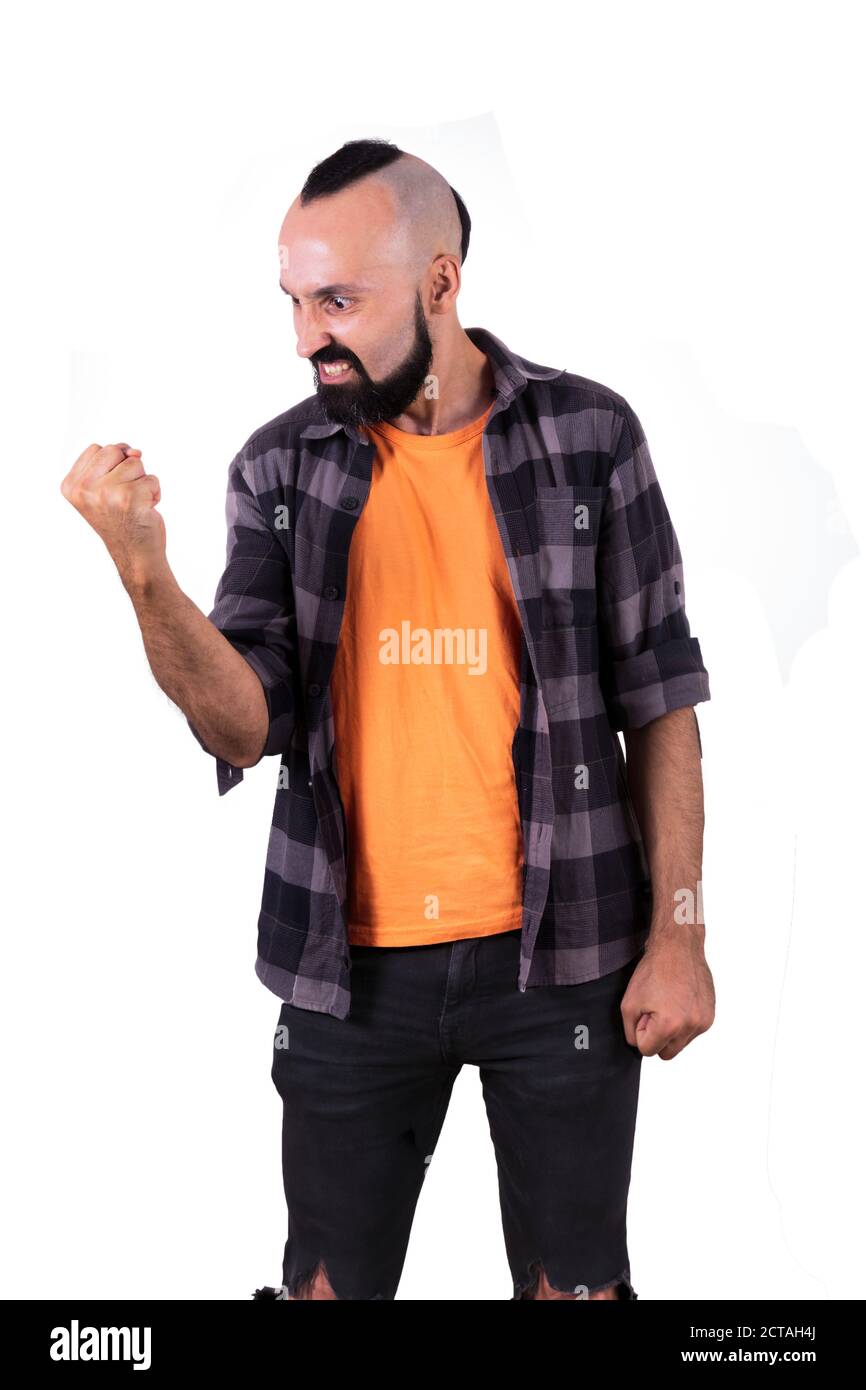 Furious young hispanic man showing power or anger Stock Photo
