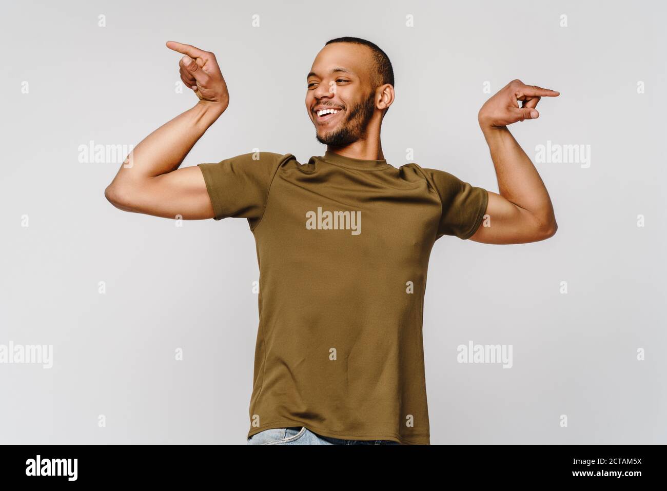 Guy flexing muscle hires stock photography and images Alamy
