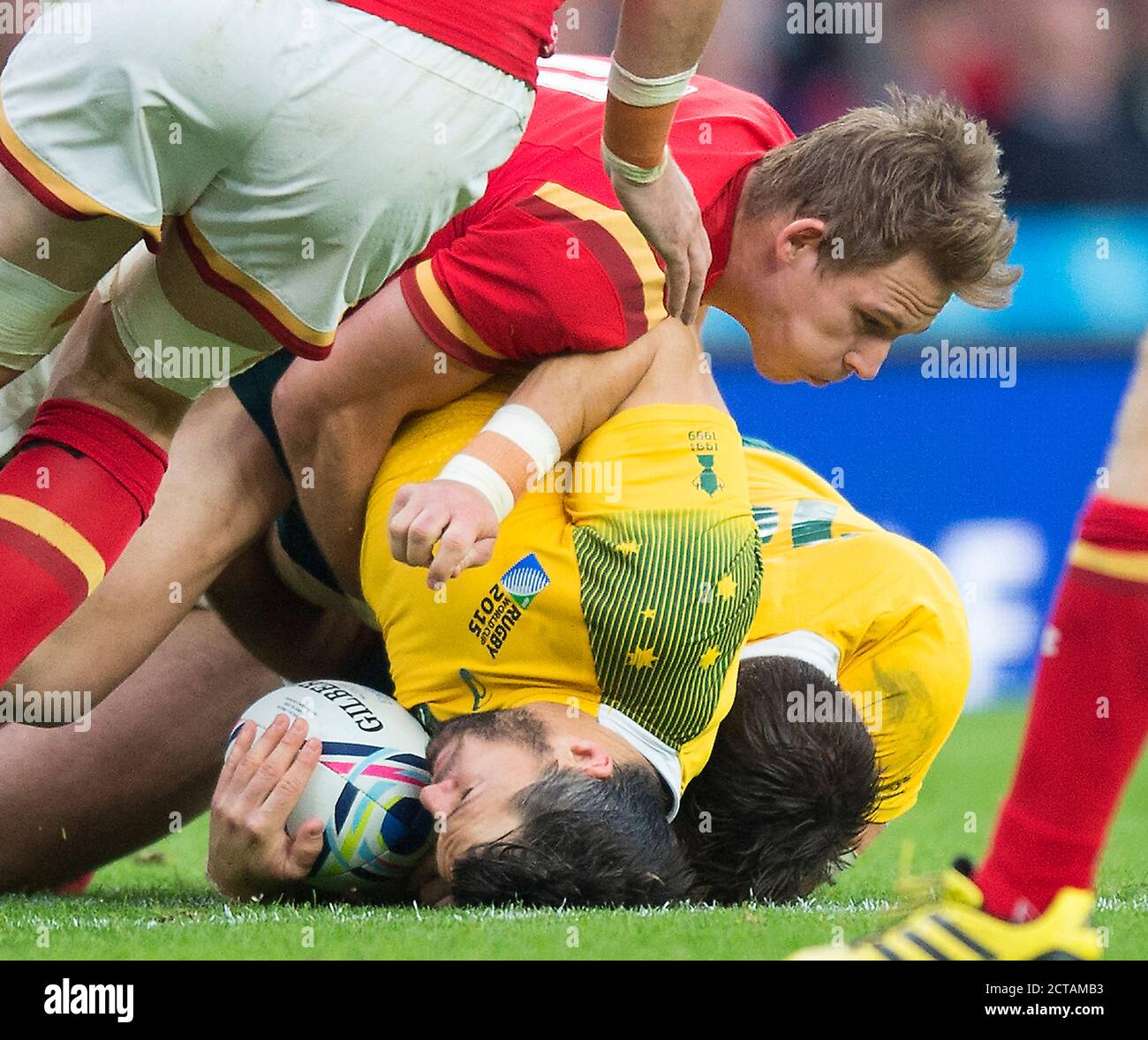 Adam Ashley-Cooper is upended by the welsh defence Australia v Wales Rugby World Cup 2015  Picture Credit : MARK PAIN / ALAMY Stock Photo