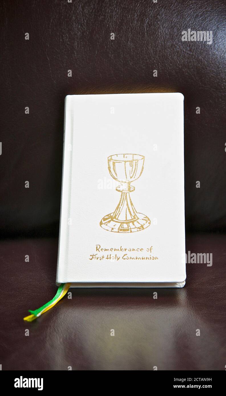 portrait of first holy communion remembrance book Stock Photo