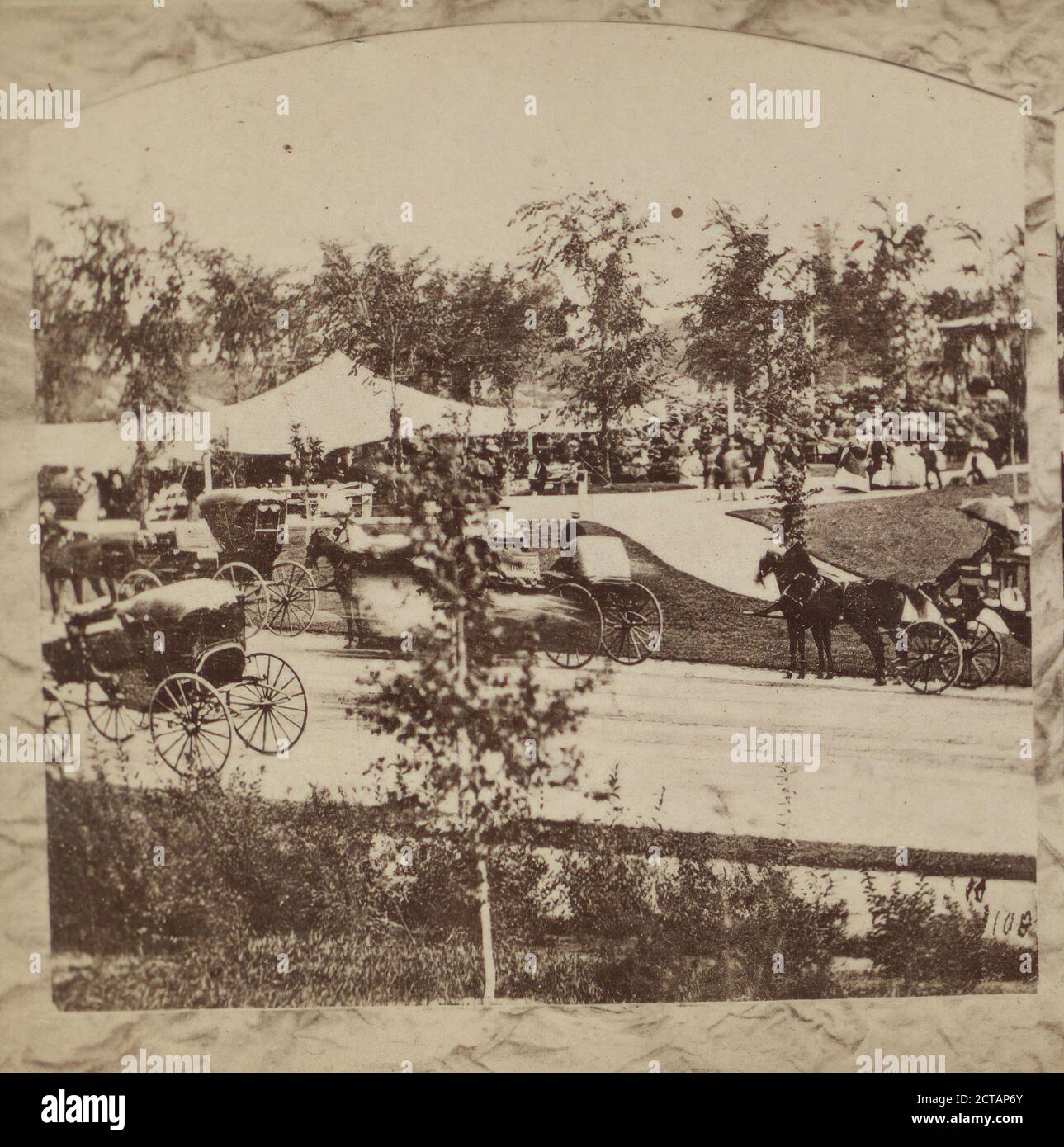 Music day in the park. Crowd and coaches gather around music stand and tents., New York (State), New York (N.Y.), New York, Central Park (New York, N.Y.), Manhattan (New York, N.Y Stock Photo