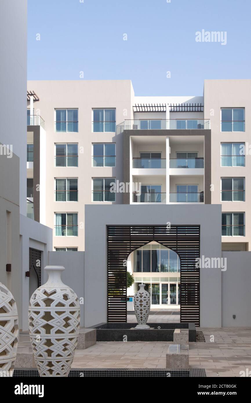 Residential building with water feature. Apartments with balconies. Al