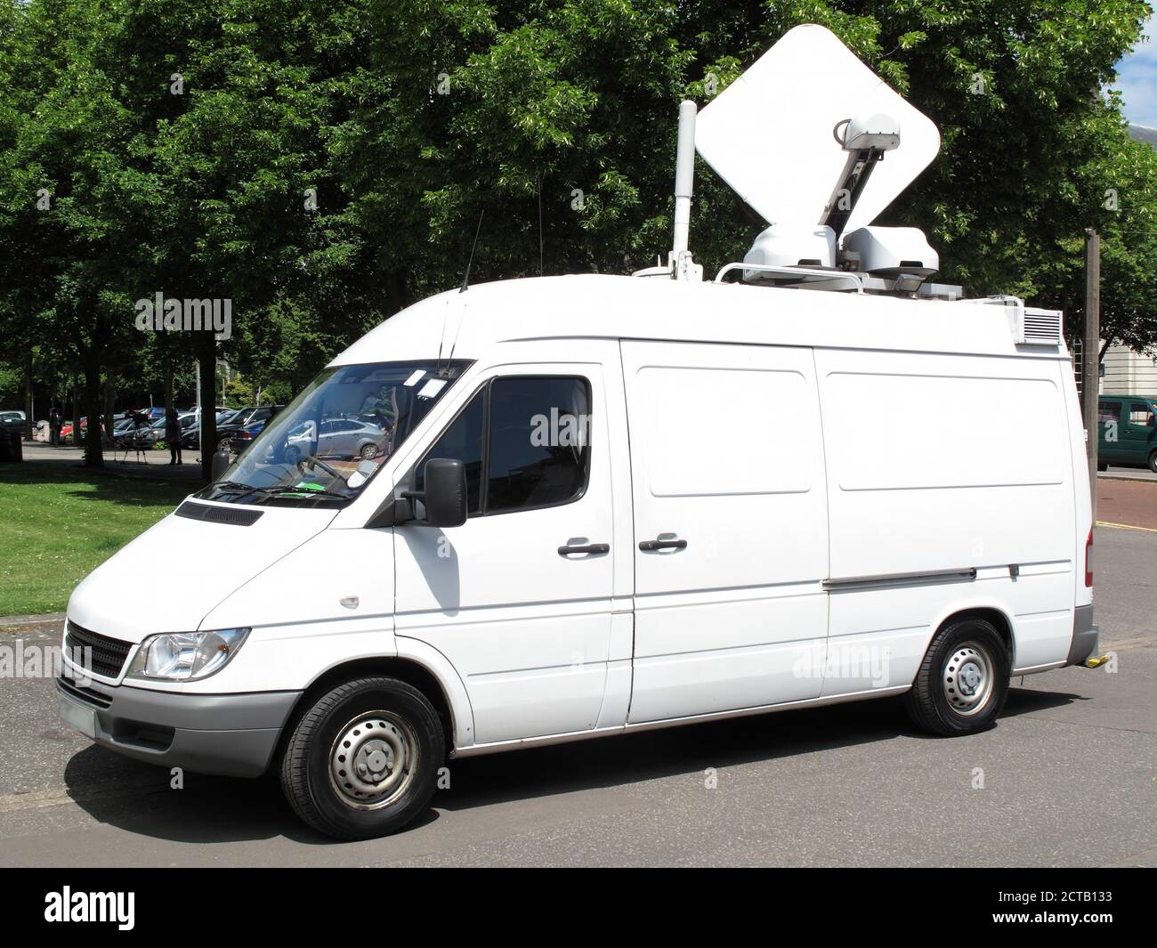 Outside broadcast white media vehicle van broadcasting breaking news