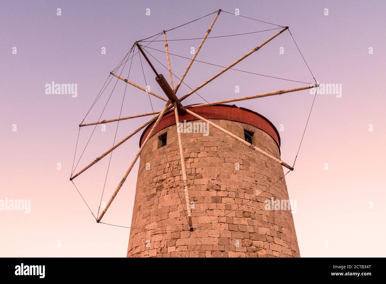 Windmill sunset in the Greek Islands Stock Photo