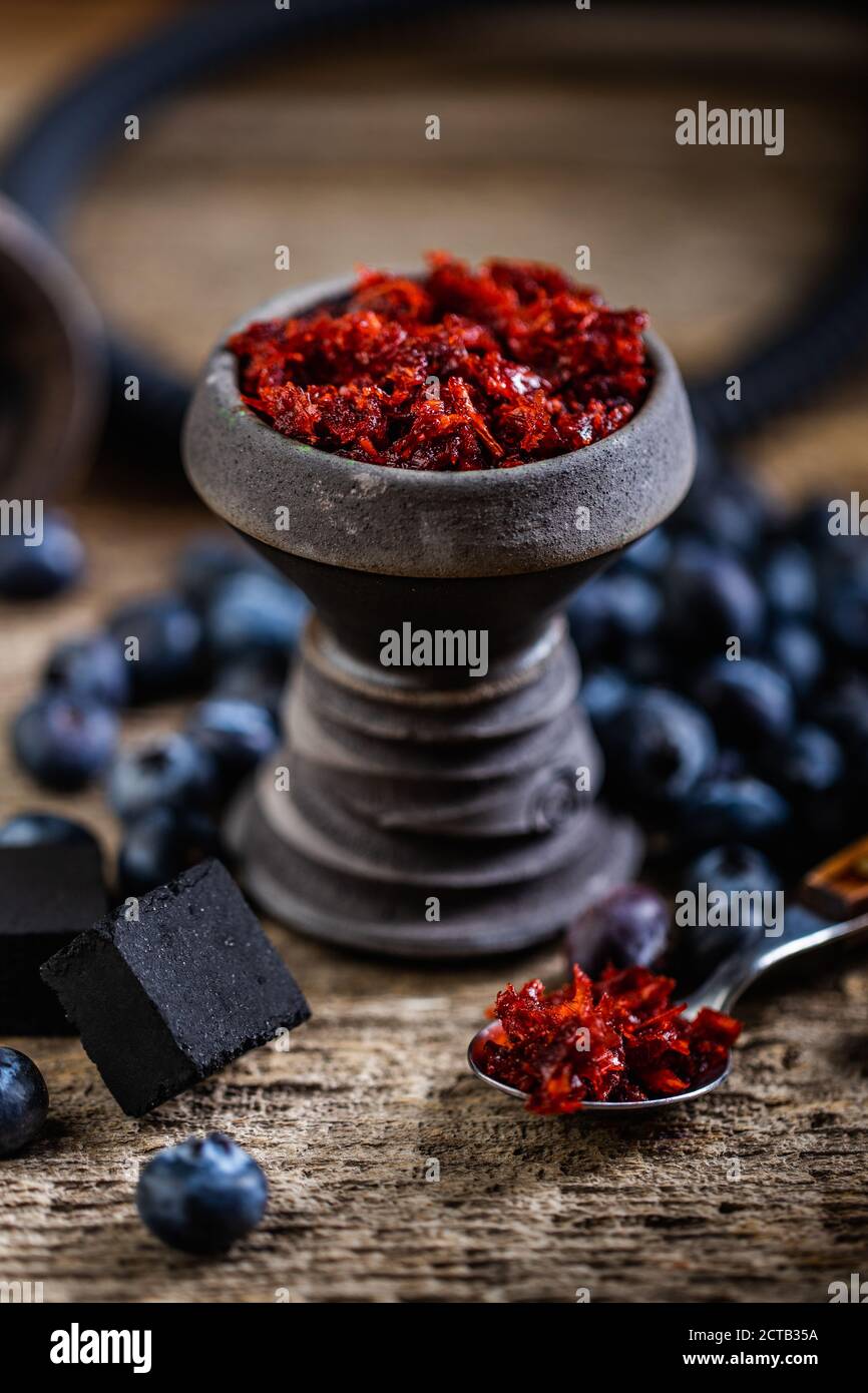 Arabian stone hookah head filled with blueberry flavoured tobacco Stock
