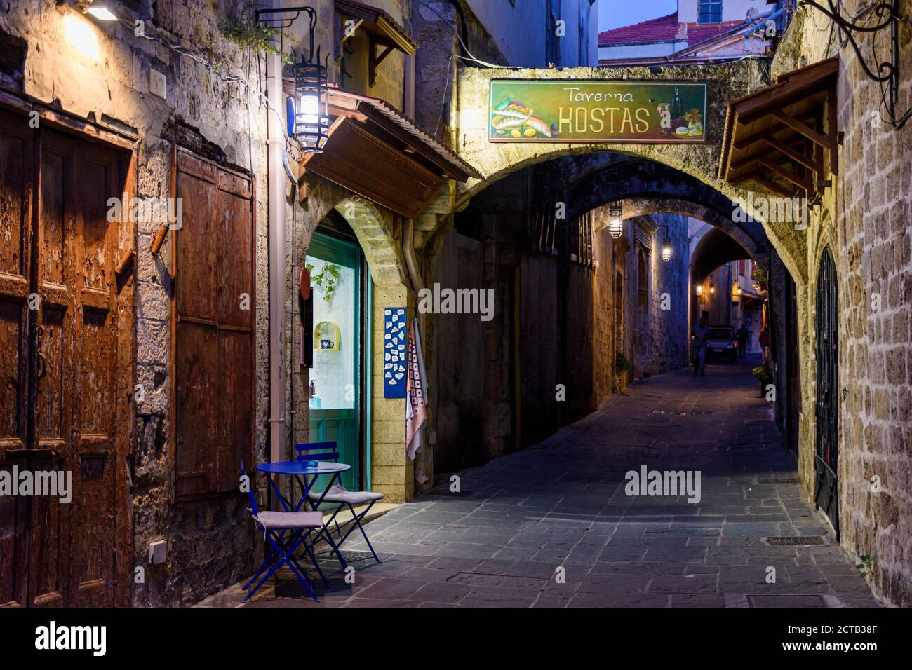 Evening views of the arched buttresses in the Medieval cobbled back streets of Rhodes Old Town, Rhodes Island, Greece Stock Photo