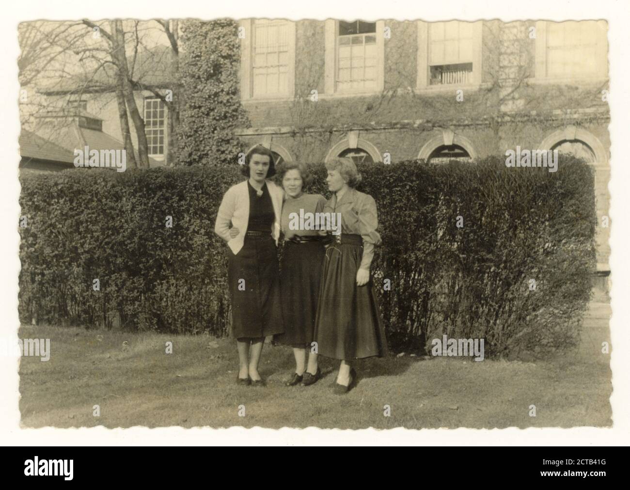 1950's era photographs of nurses out of uniform, off duty nurses, friends, posing for a photograph together outside in grounds of hospital, nurses accommodation,  U.K. circa 1955 Stock Photo