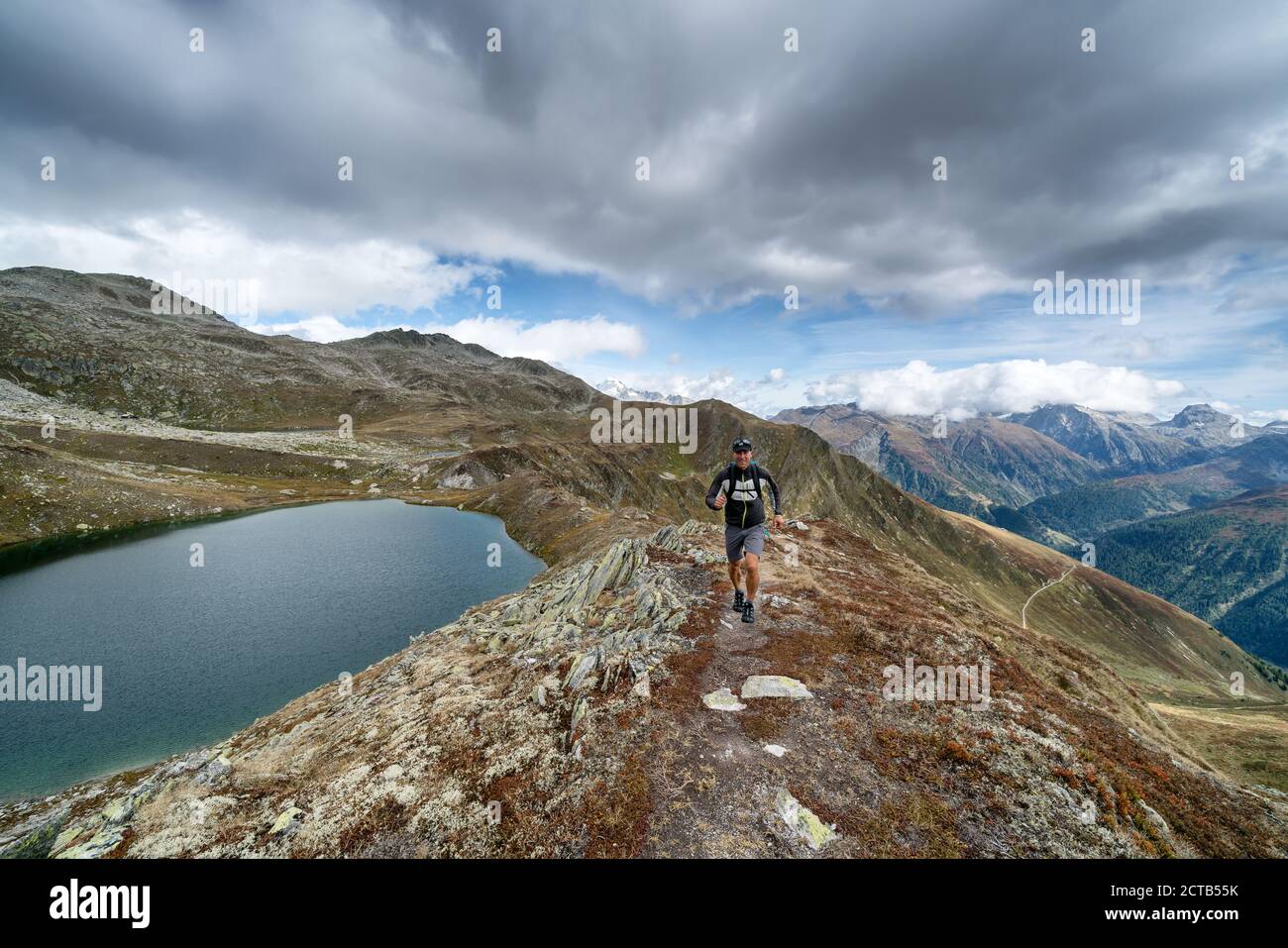 Trail running near Ulrichen, Obergoms, Alps, Switzerland Stock Photo