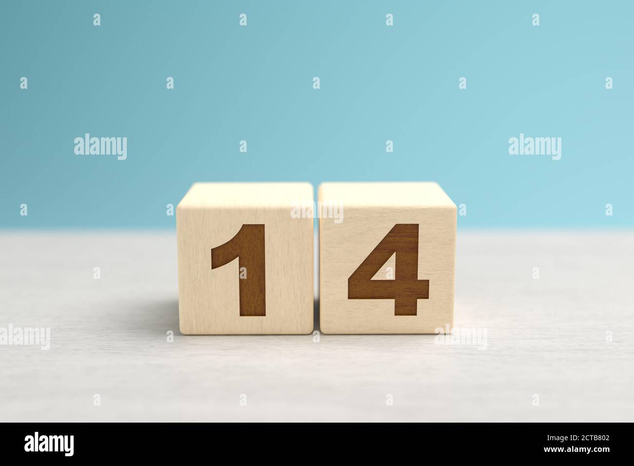 Wooden toy blocks forming the number 14. Stock Photo