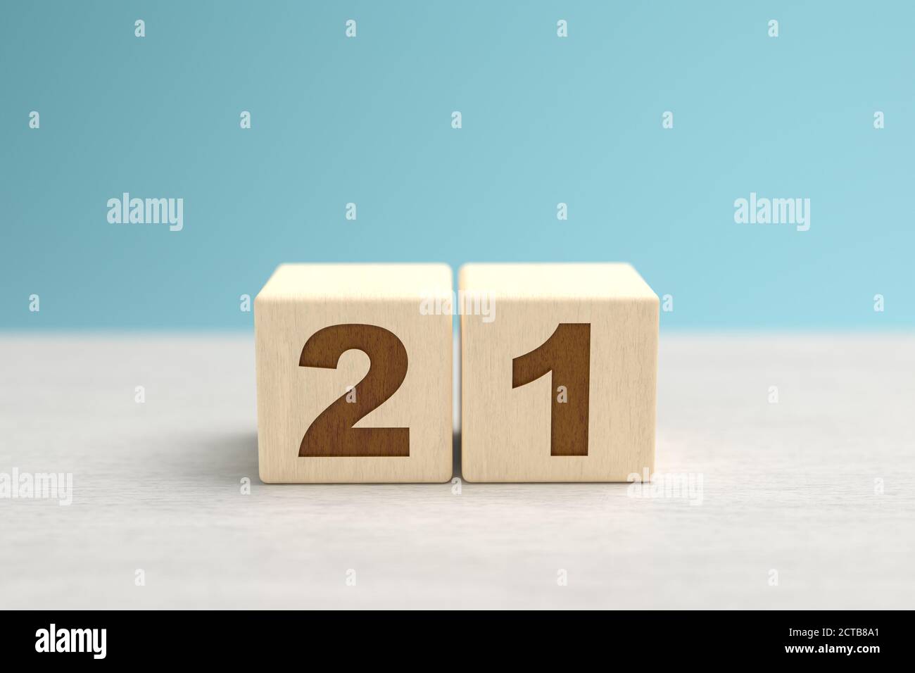 Wooden toy blocks forming the number 21. Stock Photo