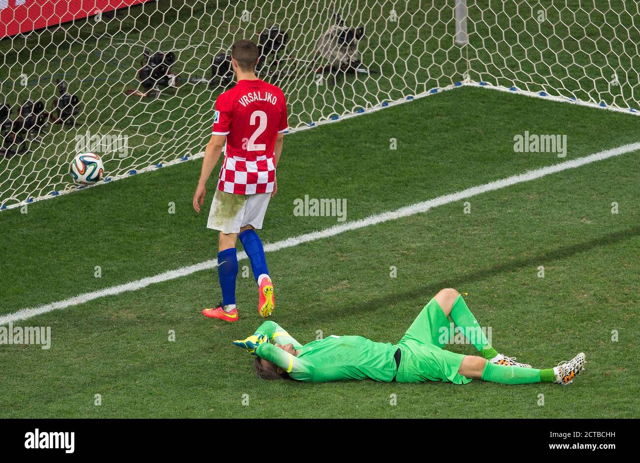 Crostian goalkeeper Pletikosa lies down and out on the floor as Oscar scores for Brazil to make it 3-1  Brazil v Croatia Brazil World Cup 2014 - Arena Stock Photo