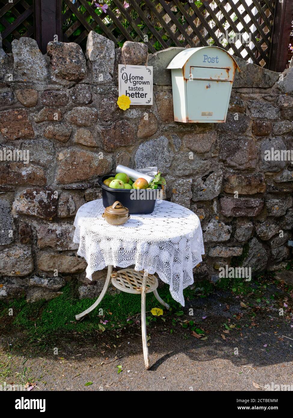 Home grown fruit for sale outside a house on the Gower Peninsula Wales UK Stock Photo