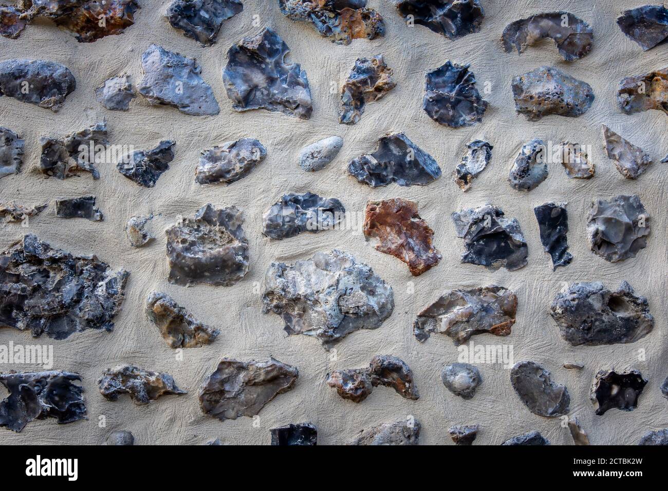 Stone wall, flint and concrete. Background, texture Stock Photo - Alamy