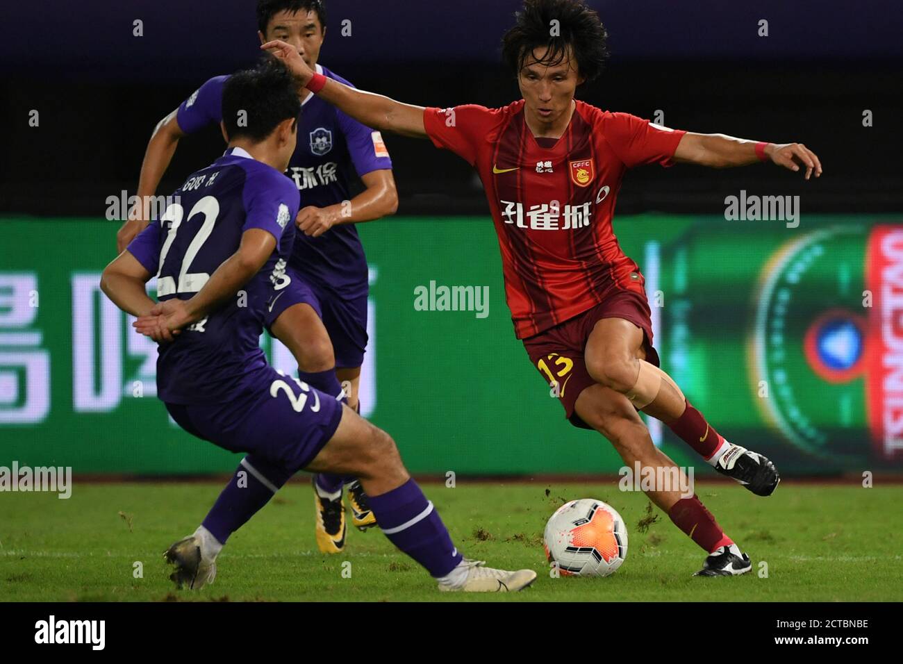 Suzhou, China's Jiangsu Province. 22nd Sep, 2020. Yin Hongbo (R) of Hebei China Fortune vies for the ball during the 12th round match between Hebei China Fortune and Tianjin Taida at the postponed 2020 season Chinese Football Association Super League (CSL) Suzhou Division in Suzhou, east China's Jiangsu Province, Sept. 22, 2020. Heibei China Fortune won 1-0. Credit: Han Yuqing/Xinhua/Alamy Live News Stock Photo