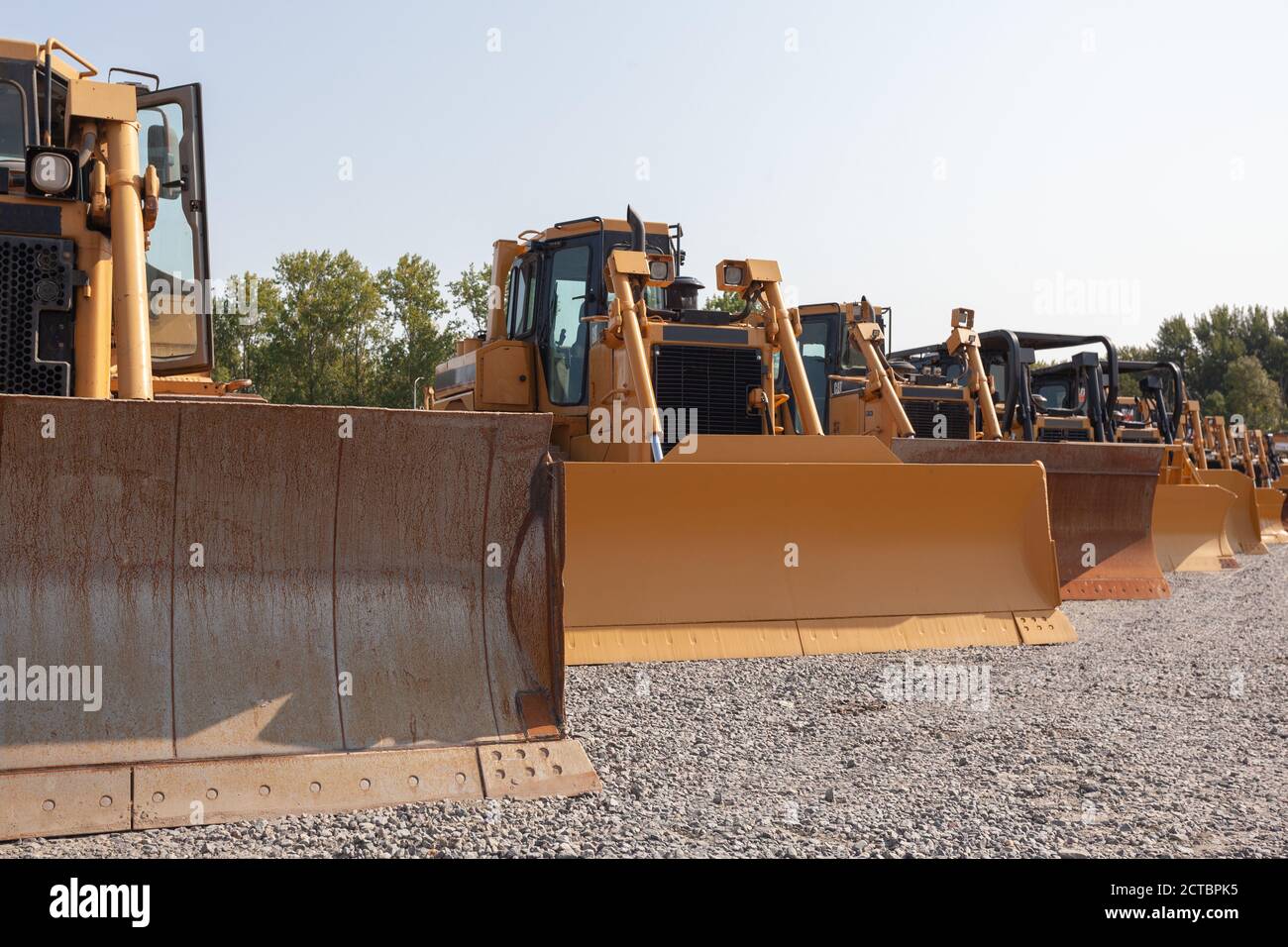 Row of bulldozers in a construction site Stock Photo - Alamy