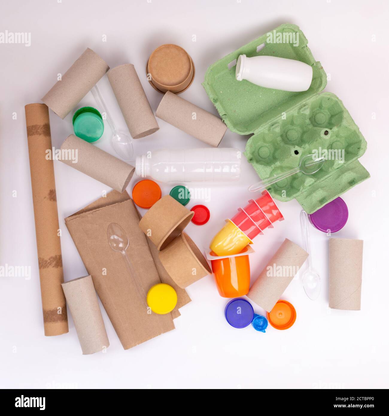 recycled craft ideas for kids, use of toilet paper rolls and other materials for creative projects, flat lay, white background, top view Stock Photo