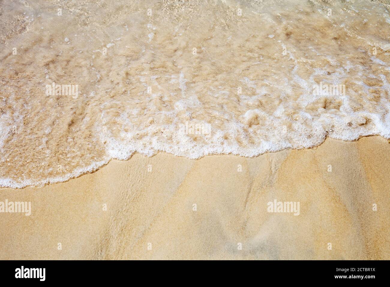 Transparent sea waves on sandy hi-res stock photography and images - Alamy