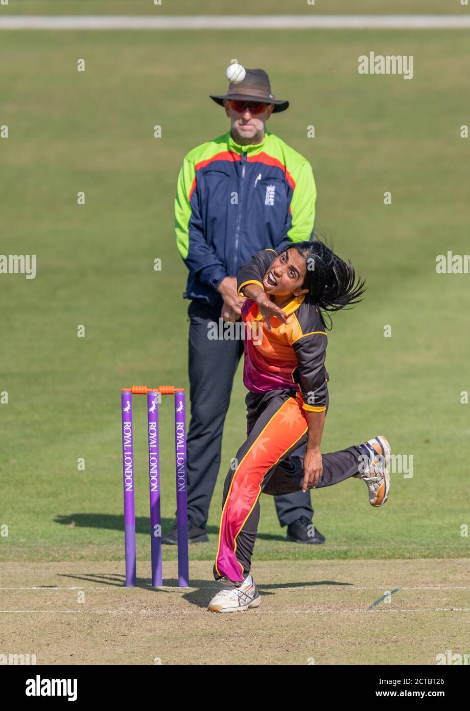 Anisha Patel bowling for Central Sparks against Lightning in a Rachael Heyhoe Flint Trophy match. Umpire is Paul Pollard. Stock Photo