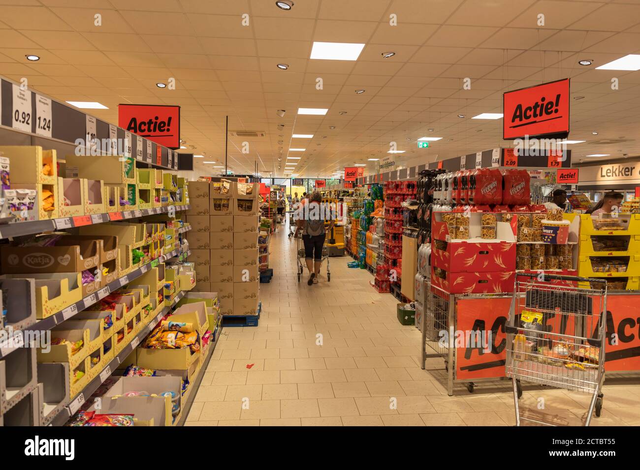 Weert,Holland,05-sep-2020: woman shopping in a supermarket with shells full of food and non food sale products Stock Photo