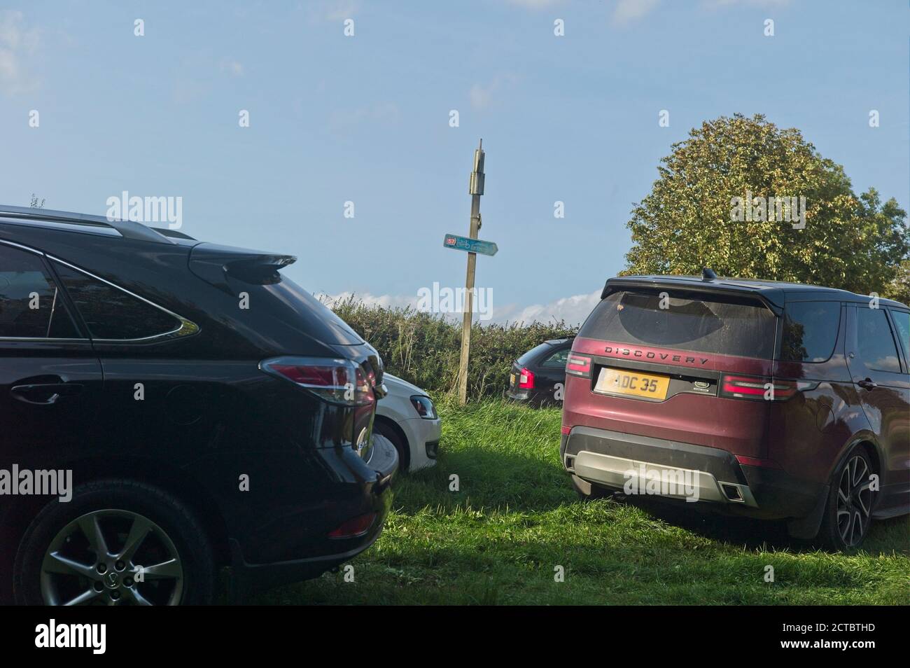 Parked cars in a rural setting. Stock Photo
