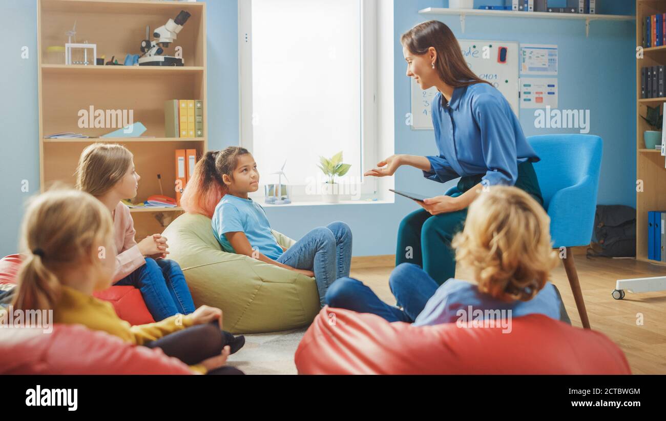 School Creativity Class: Children Sitting on the Bean Bags while Caring ...