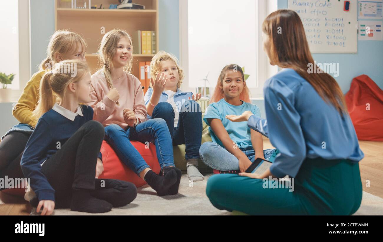 School Creativity Class: Children Sitting on the Bean Bags while Caring ...