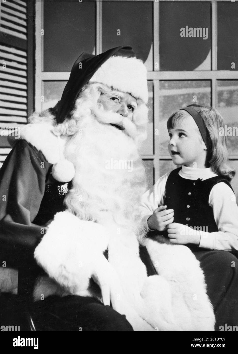 Santa Claus with child in Sears, Roebuck, Washington, DC, 1967. (Photo by Sears, Roebuck/United States Information Agency/RBM Vintage Images) Stock Photo