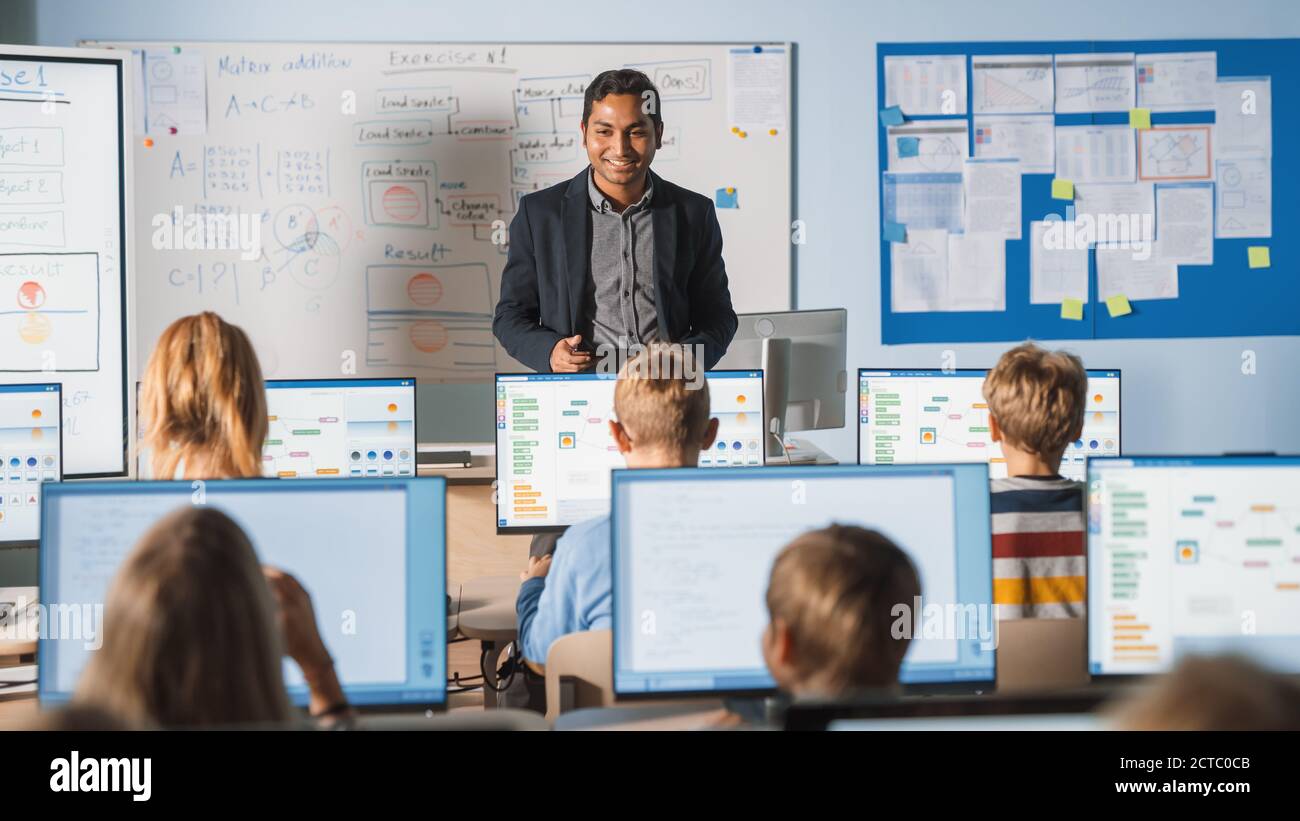 Elementary School Computer Science Class: Teacher Uses Digital Tablet ...