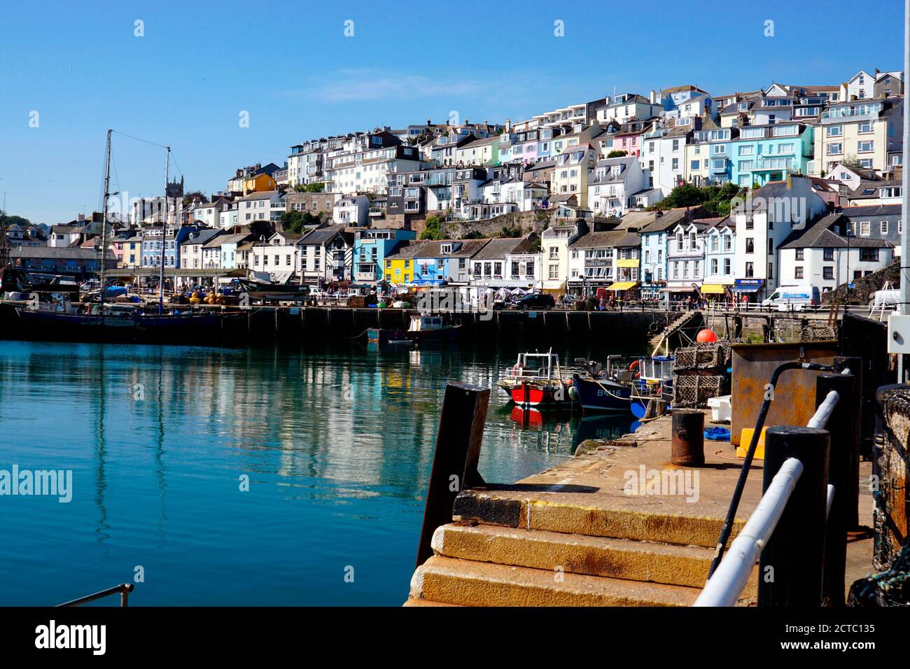 Brixham, Devon, UK. September 14, 2020.    Beautiful various tiered architecture reflecting in the harbour at Brixham in Devon, UK. Stock Photo