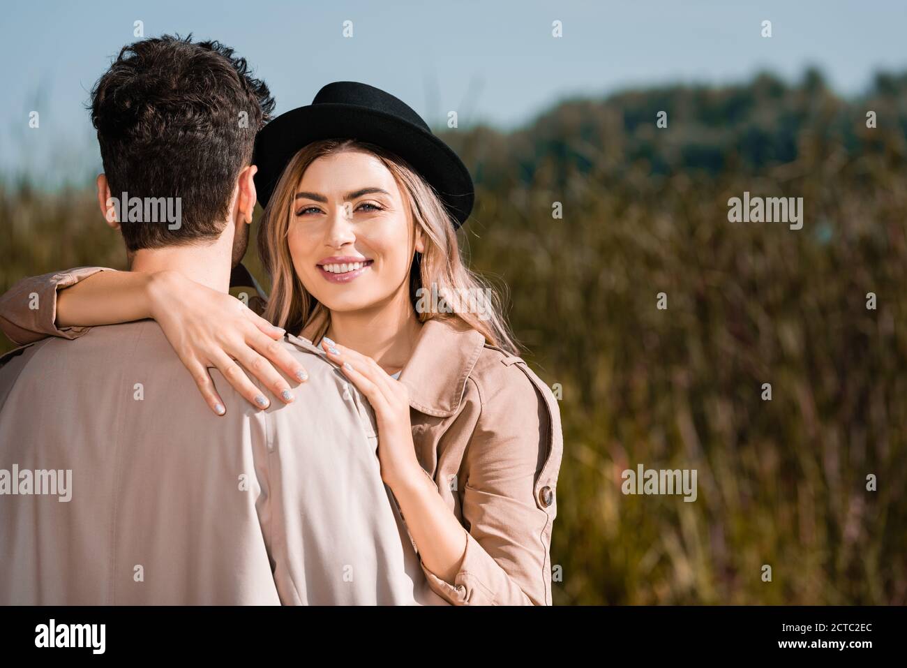 Woman in trench coat back view hi-res stock photography and images - Alamy