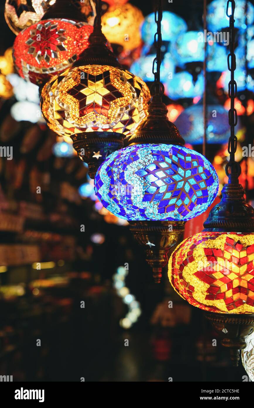Colorful Turkish style mosaic lamps hanging in bazaar Stock Photo