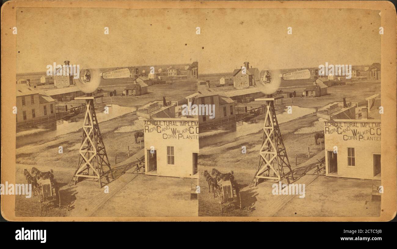 General view of Great Bend showing wind mill, implement store, homes, other buildings., still image, Stereographs, 1850 - 1930 Stock Photo