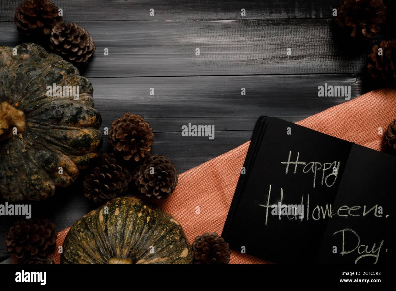 Halloween background with pumpkins isolated on dark background. Copy space for text. Festive concept. Stock Photo