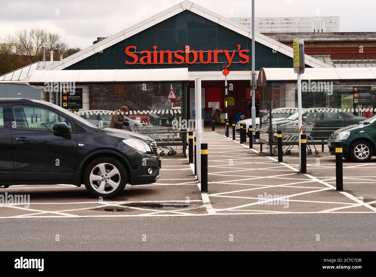 The logo of Sainsbury's supermarket seen from the car park in front of