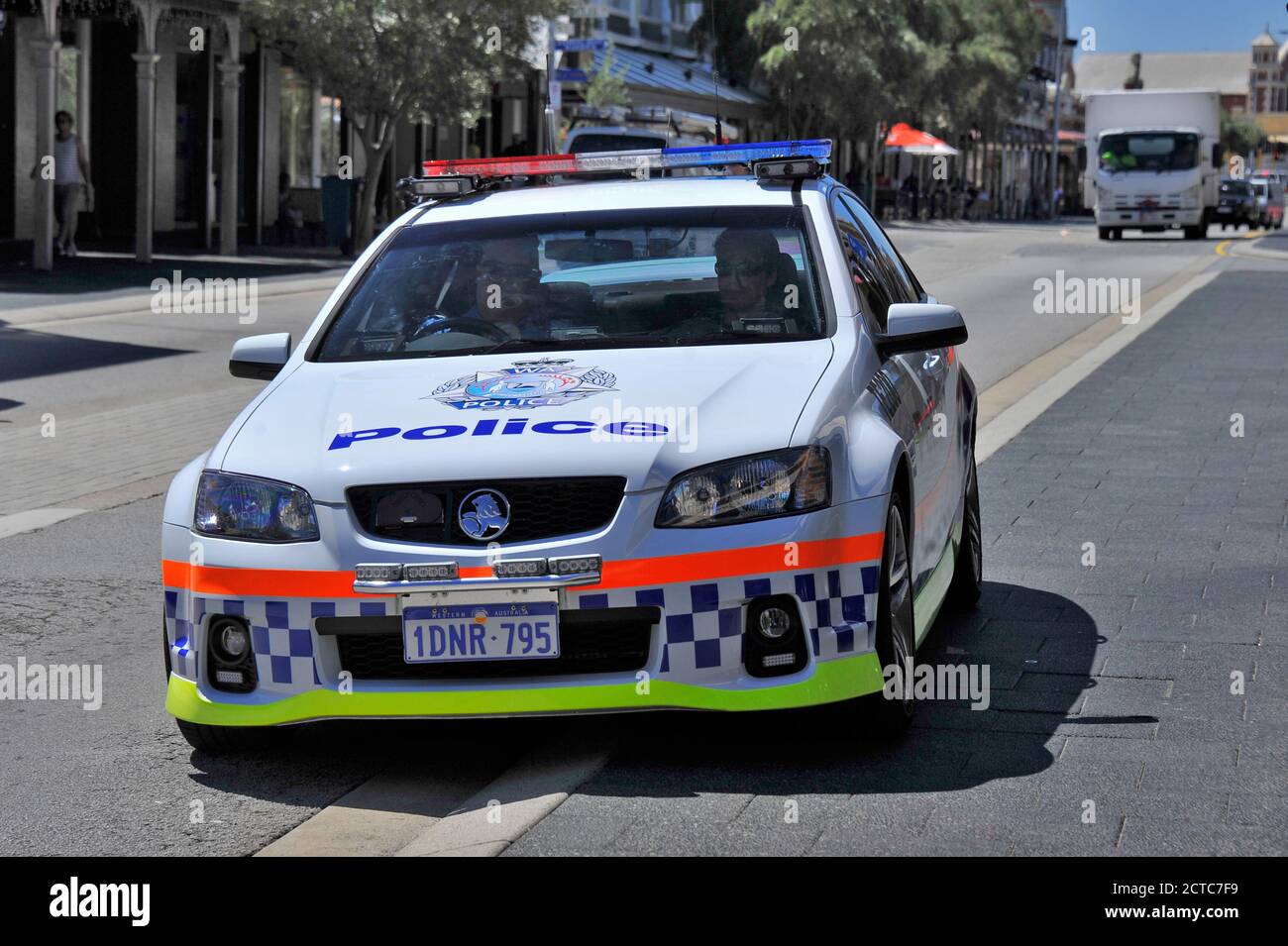 A Holden Police car, in Western Australian Police livery, in an urban environment. Stock Photo