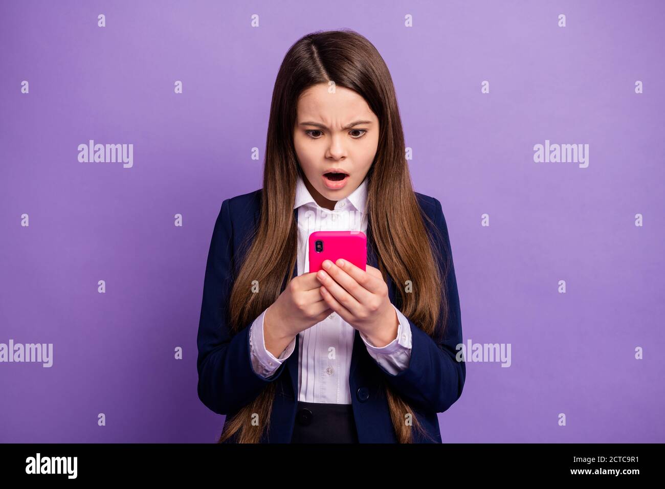 Portrait of her she small little dissatisfied long-haired girl using gadget browsing reading negative comment feedback communicate isolated bright Stock Photo