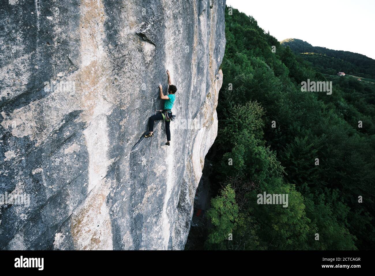 A male climber climbing up a clif in Zagorje, a region in Croatia Stock Photo