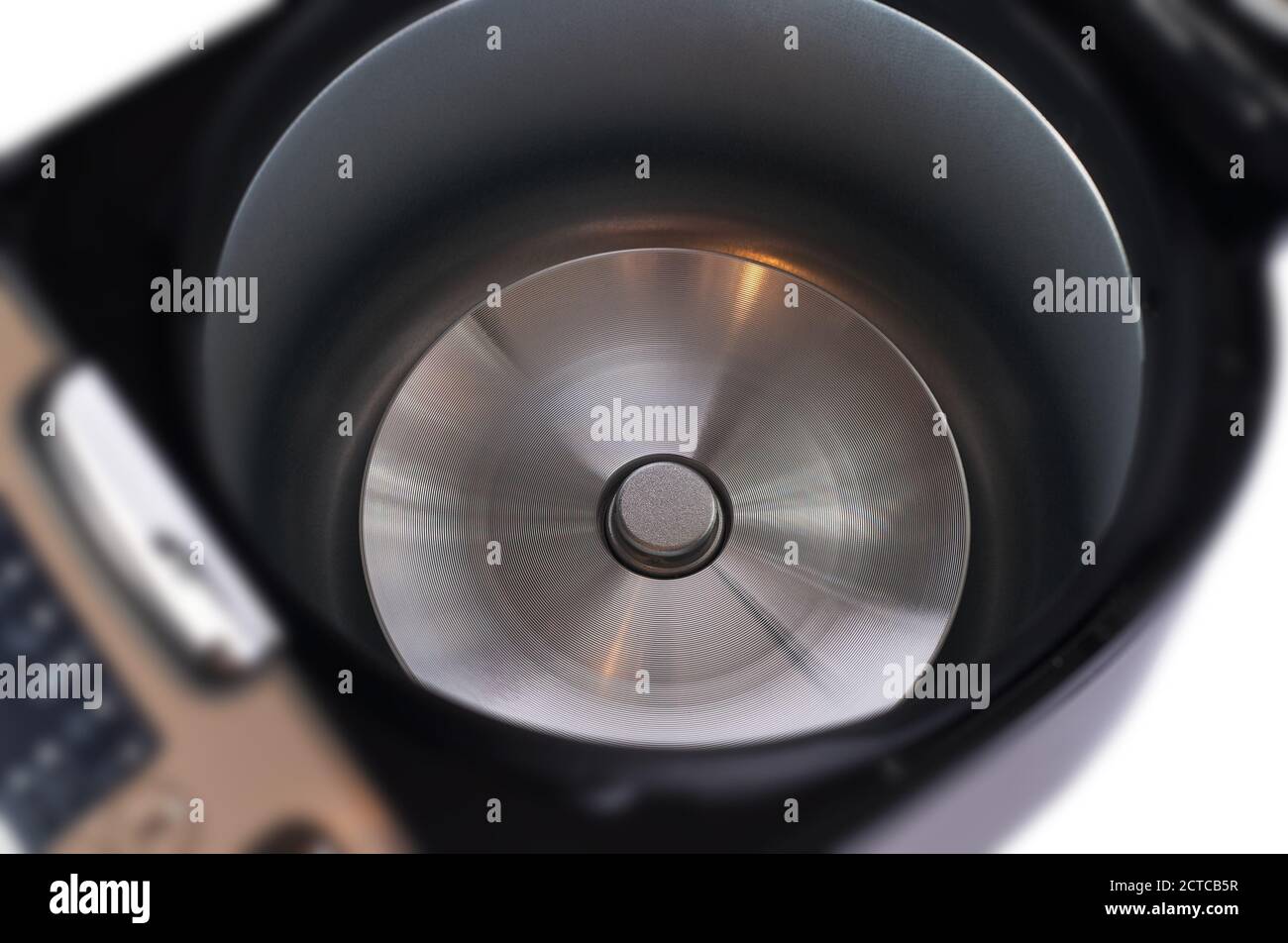 Automatic modern multicooker isolated on white background. Household appliances programmed for the preparation of various dishes. Bronze-colored steel Stock Photo